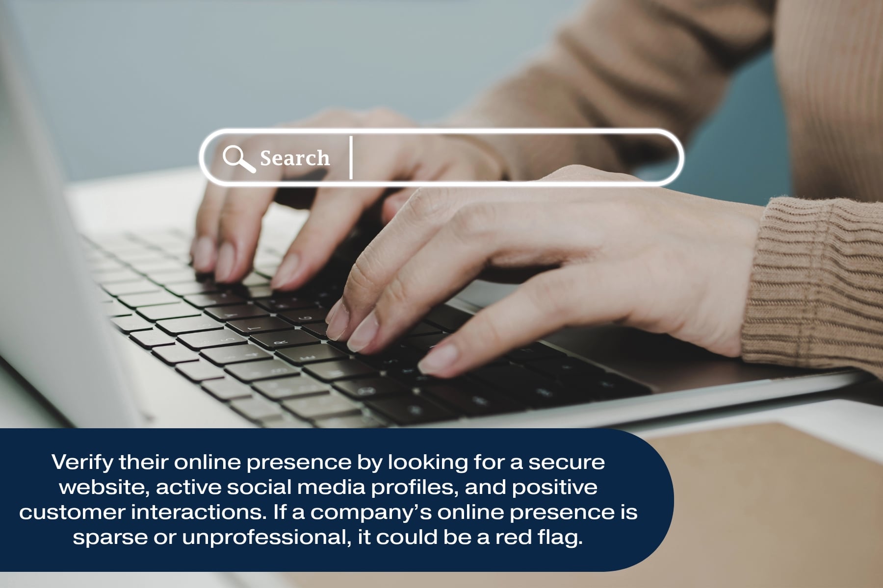 Person searching online for garage door company on laptop, highlighting importance of researching trustworthy garage door repair companies